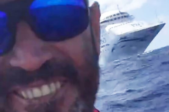 Sailor Ben Johnson, on board a life raft videos the P&O cruise ship Pacific Dawn sailing towards them.