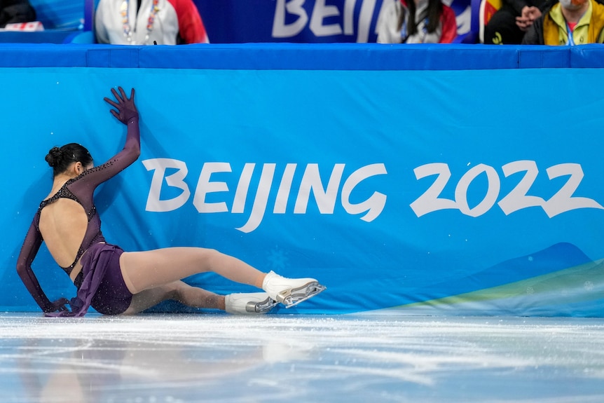 Zhu Yi steadies herself after falling on down the ice.  