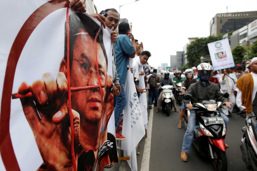 Muslim groups protest outside a court