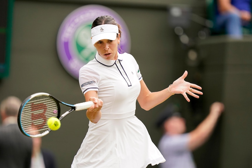Ajla Tomljanović hits a bacll at Wimbledon