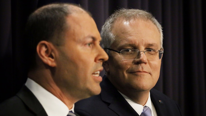 Scott Morrison looks at Josh Frydenberg speaking during