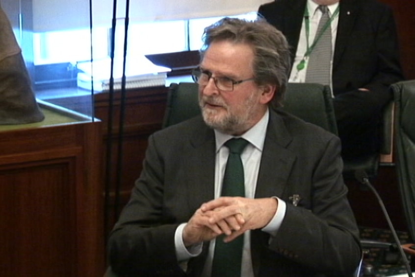 Richard Connock sitting in  Tasmanian Parliament