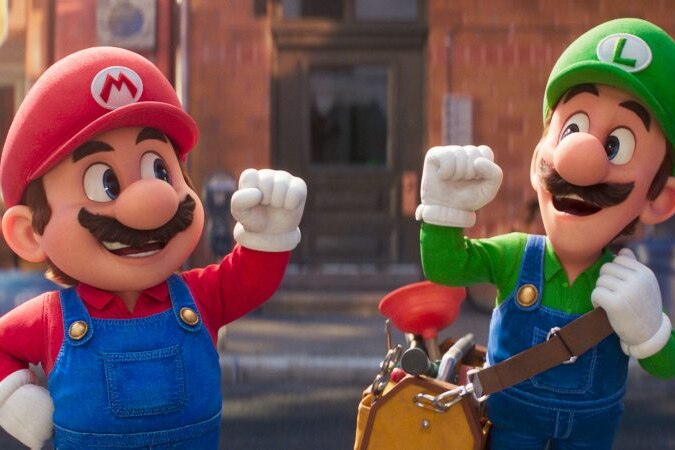 Mario and Luigi fist bumping.