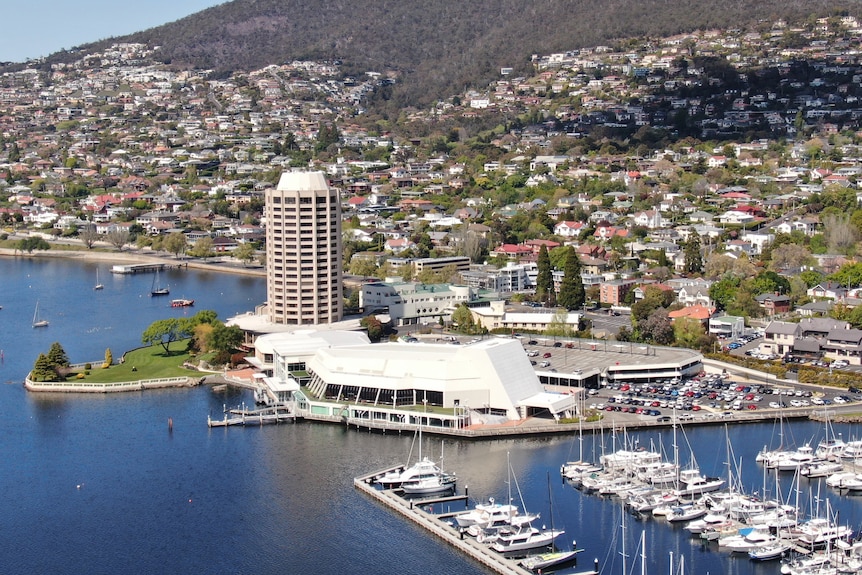 A tall casino tower on the waterfront.