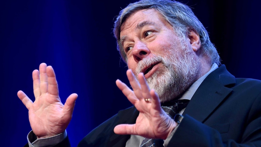 Steve Wozniak, a man with grey hair and a suit, talks at a product launch.