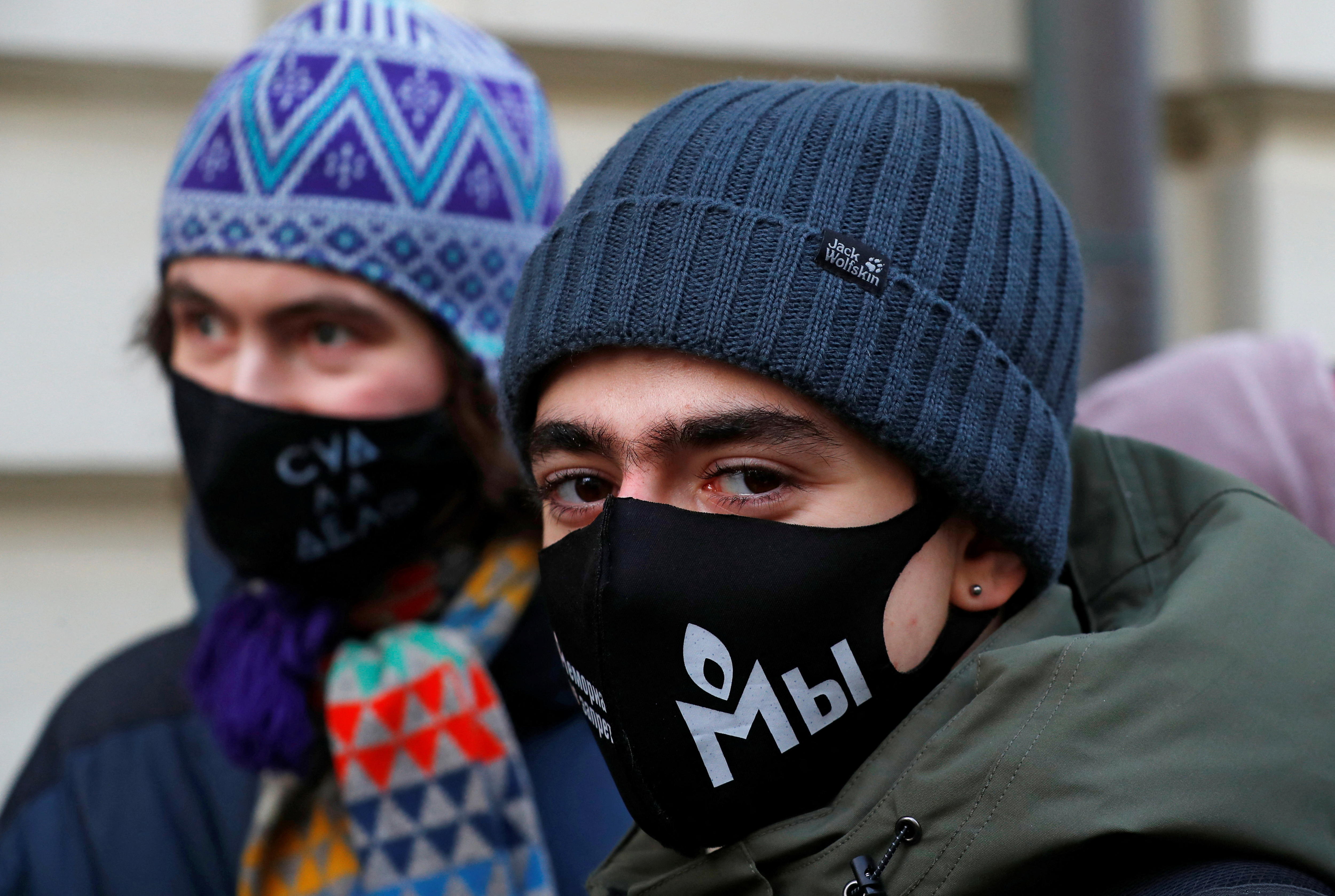A person wearing a mask and mask glares