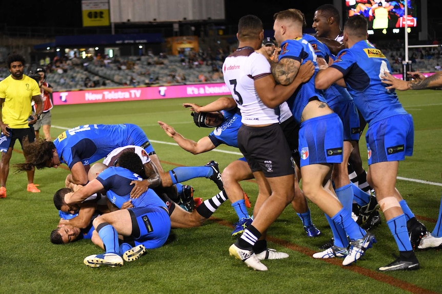 A scuffle breaks out between Fiji and Italy players at the Rugby League World Cup match in Canberra.
