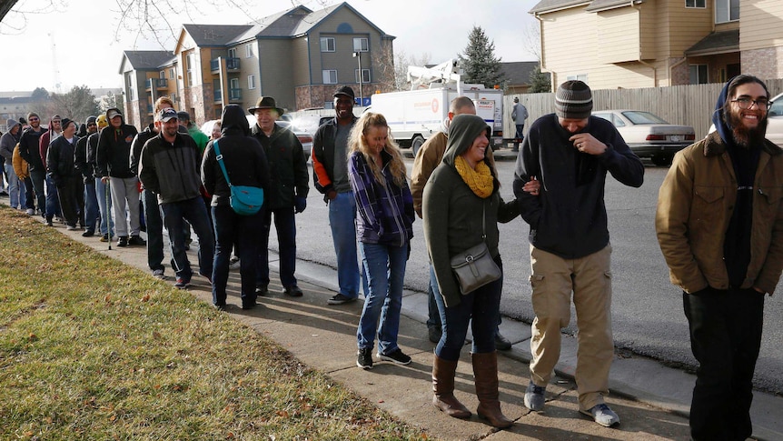 People queue to buy recreational marijuana in Colorado.