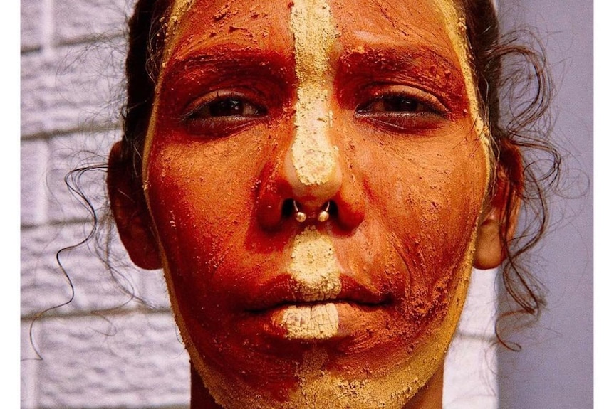Gomeroi-Kooma woman Ruby Wharton with a painted face.