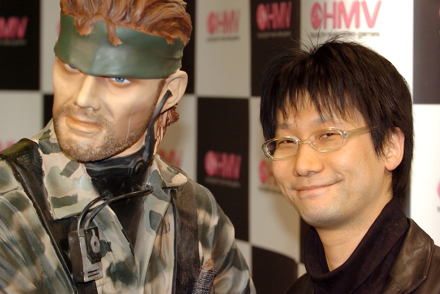 Kojima next to a Metal Gear Solid character at the release of the third game in 2005.