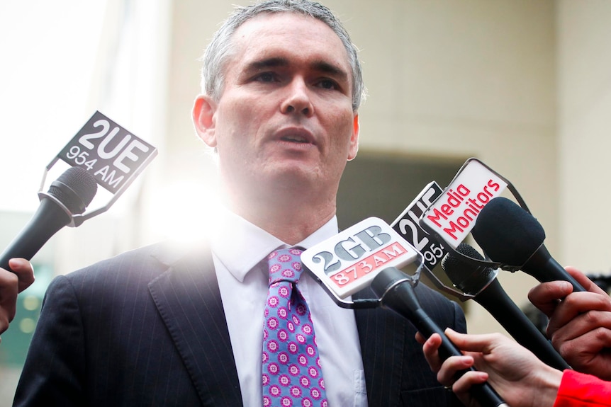 Craig Thomson speaks to the media at Parliament House.