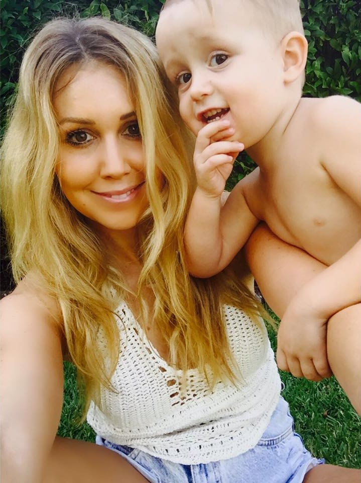 Eryn Ford in the garden with her son as a baby