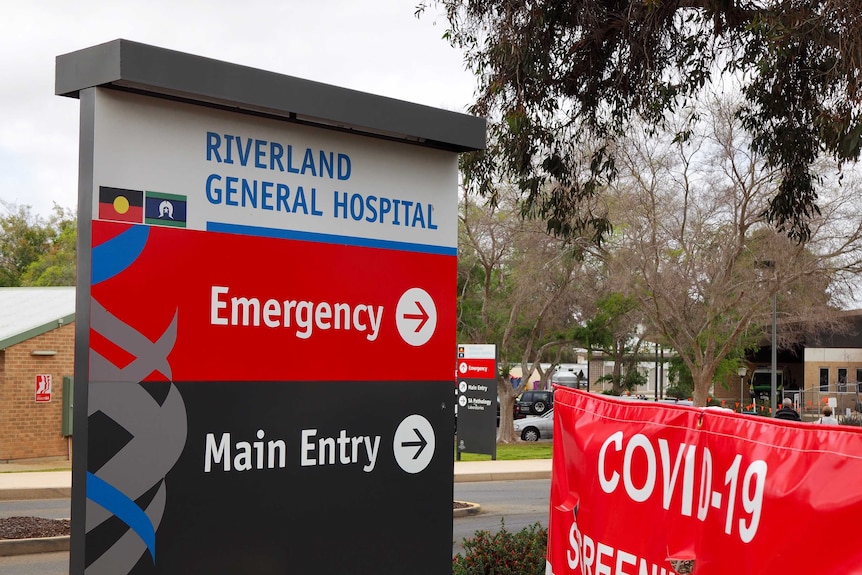 Picture of Riverland General Hospital entrance sign, with arrows pointing to the ED and main entry.