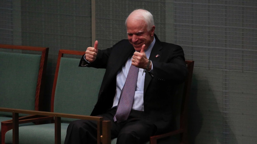 John McCain gives the thumbs up in Australia's Federal Parliament