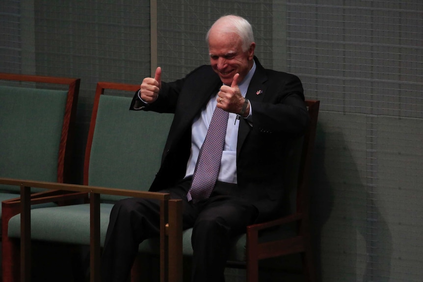 John McCain gives the thumbs up in Australia's Federal Parliament