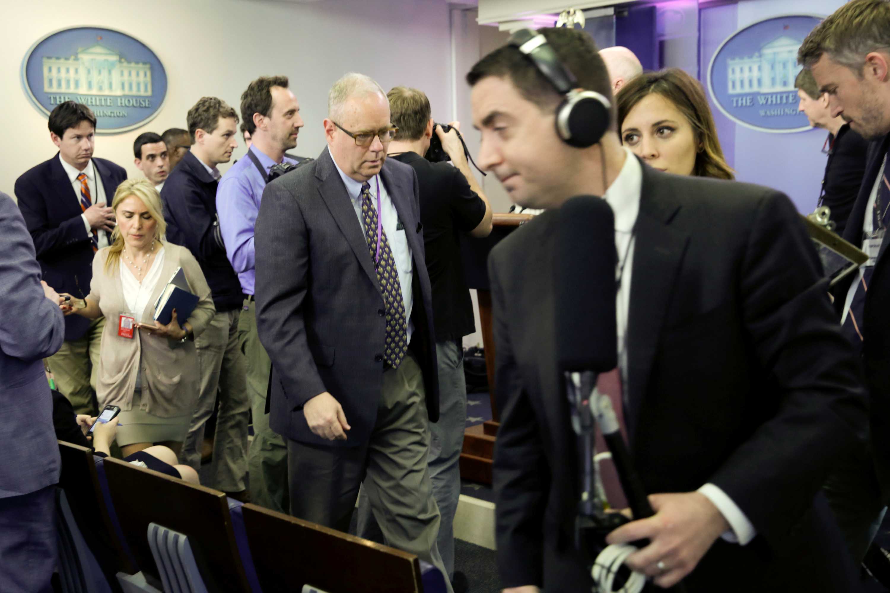 Journalists leave a White House press briefing