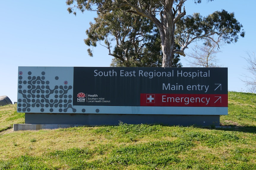 a sign of the South East regional hospital with arrows pointing to main entry