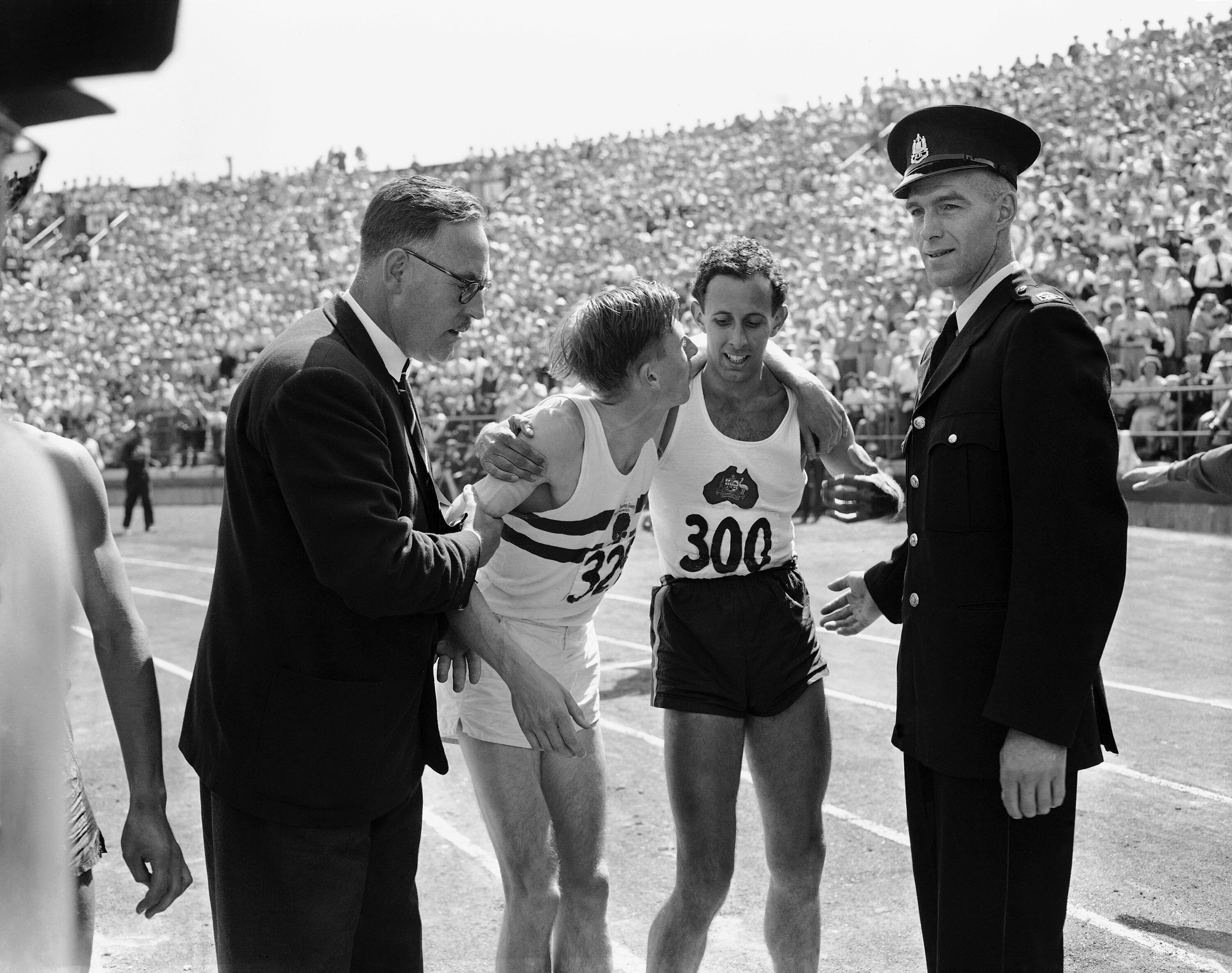 Roger Bannister and John Landy embrace after the mile at the 1954 British Empire Games.