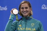 Madeline Groves holds her silver medal.