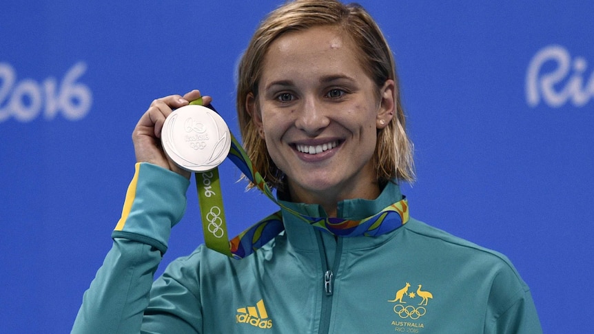 Madeline Groves holds her silver medal.