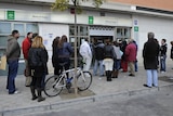 Spaniards wait in line at employment office
