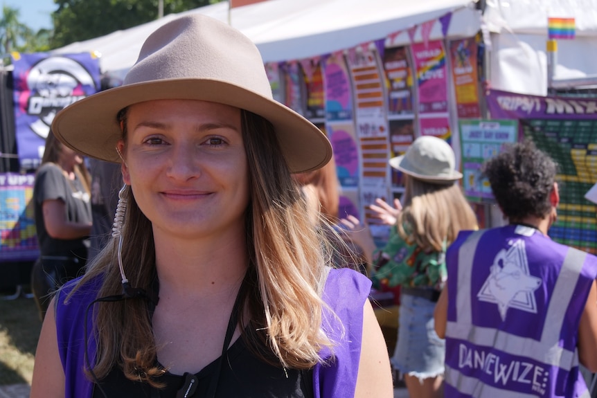 Dancewize co-ordinator Steph Tzanetis looks at the camera in front of the Dazncewize tent at the festival.