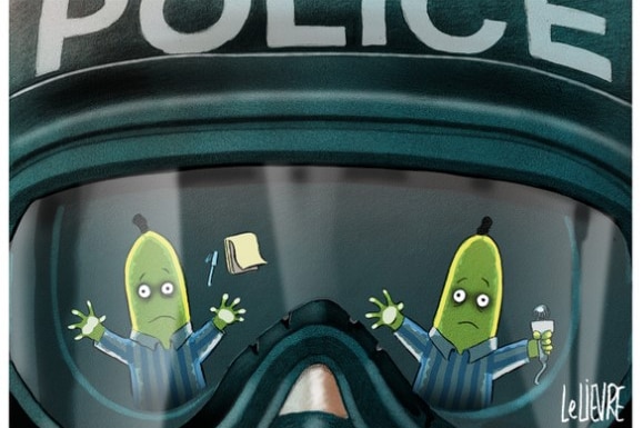 Two scared bananas in pyjamas reflected in a policeman's visor.