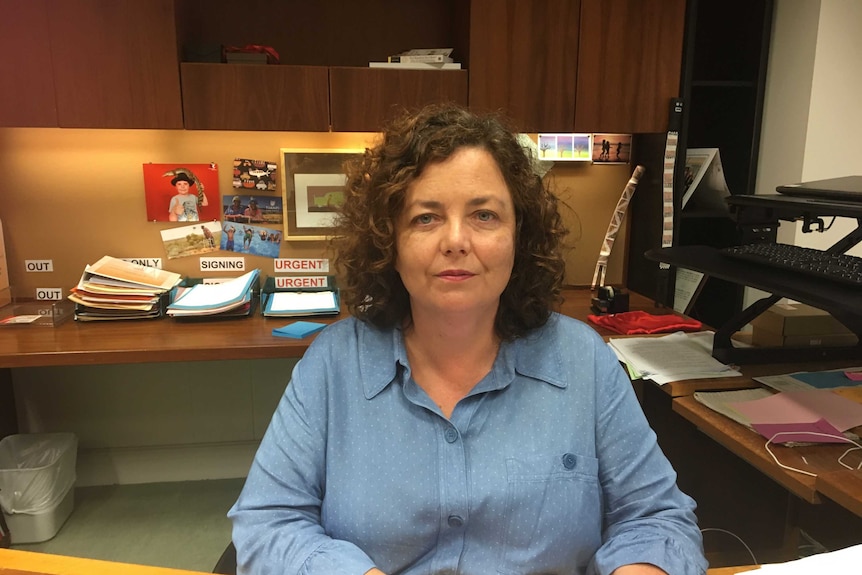 Minister for Territory Families, Dale Wakefield, sits at her desk in her office.