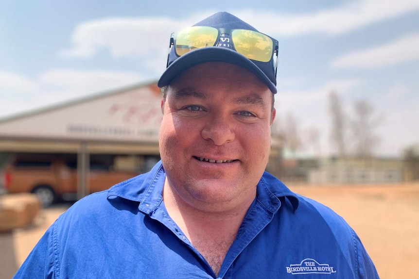 Ben Fullager, hotel manager, outside with sunglasses on cap