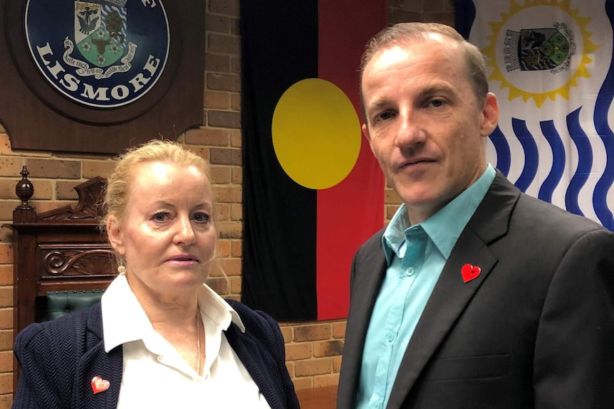 Lismore City Council's general manager Shelley Oldham standing next to Mayor Isaac Smith in the chambers.