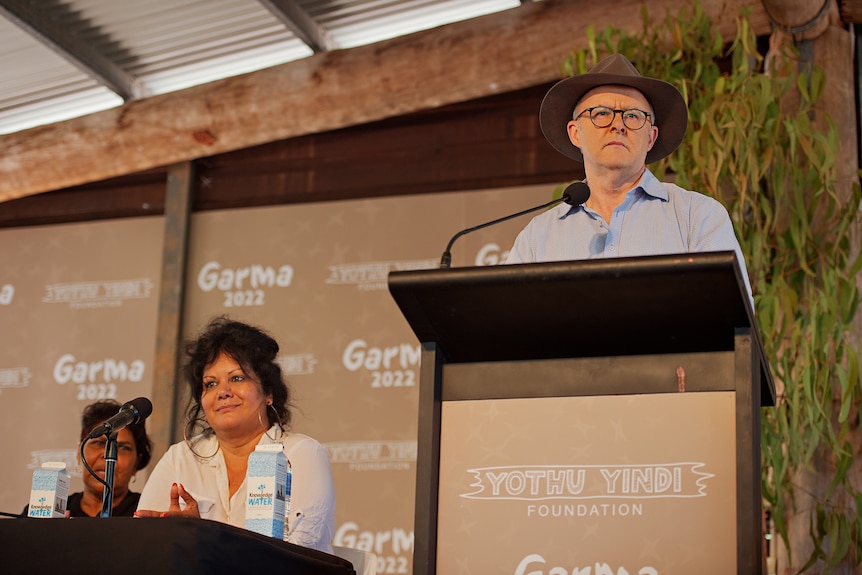 Anthony Albanese speaks from a podium on a stage at the Garma Festival