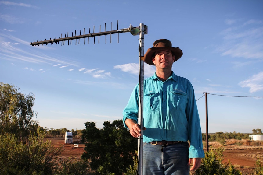 Will Seymour standing on his roof with a repeater