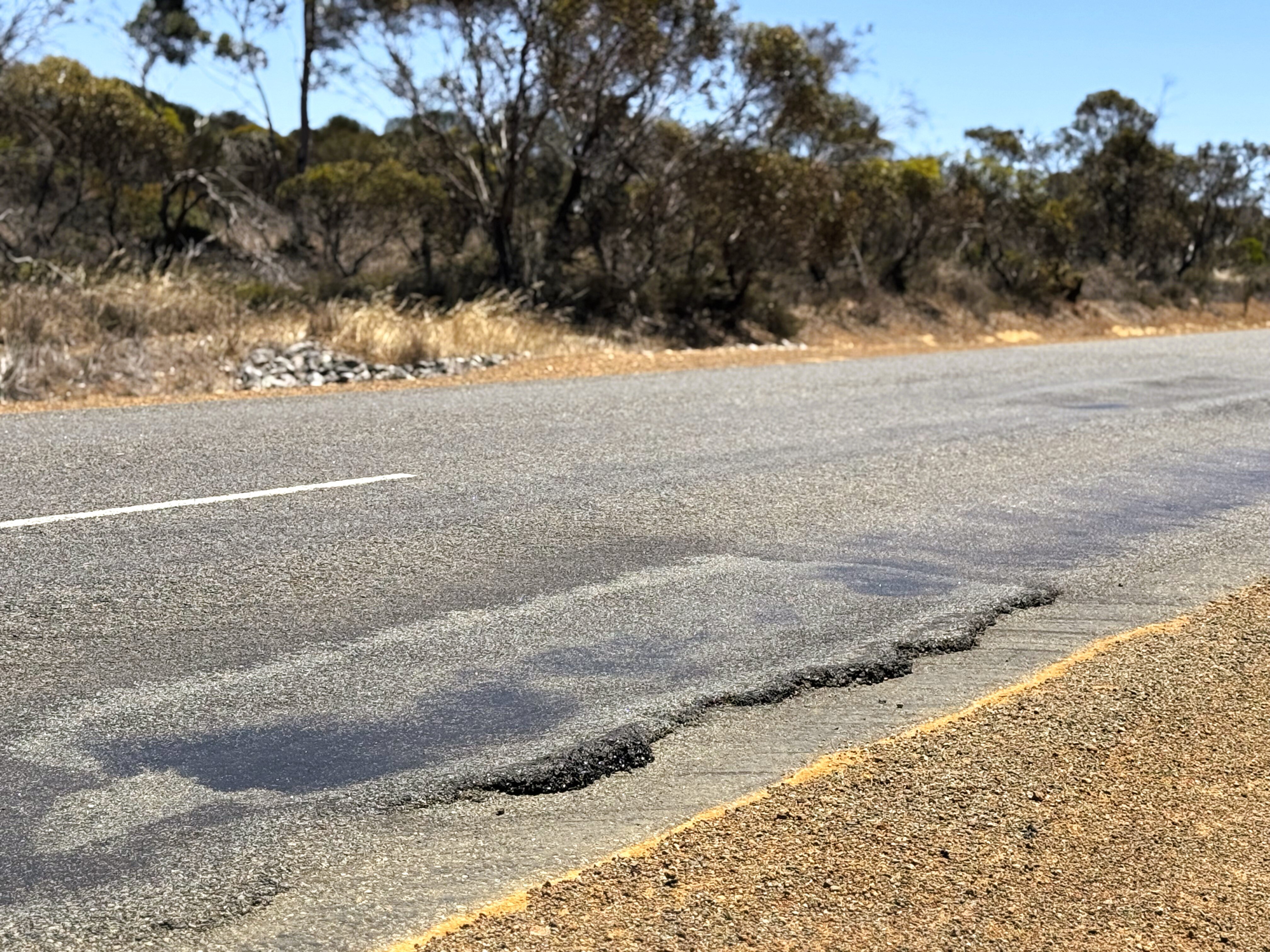 Close up generic image of a rough road edge in a regional area
