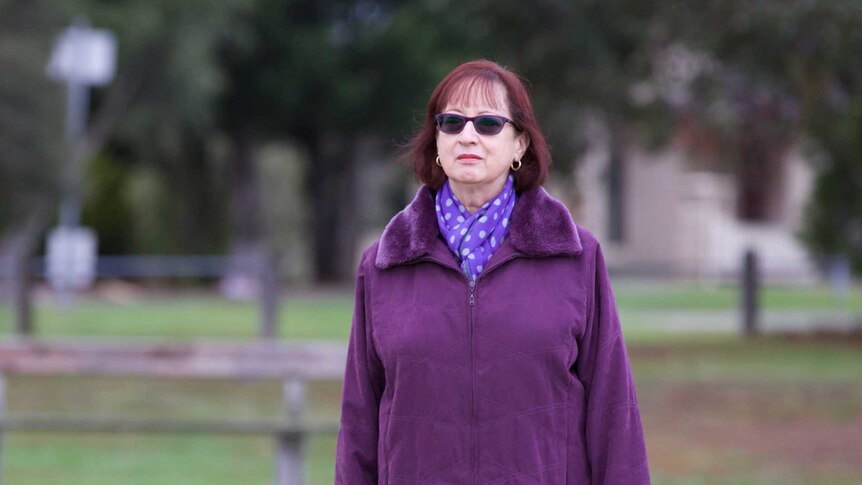 Josephine Greensill alone in a park