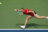 Kim Clijsters returns a shot