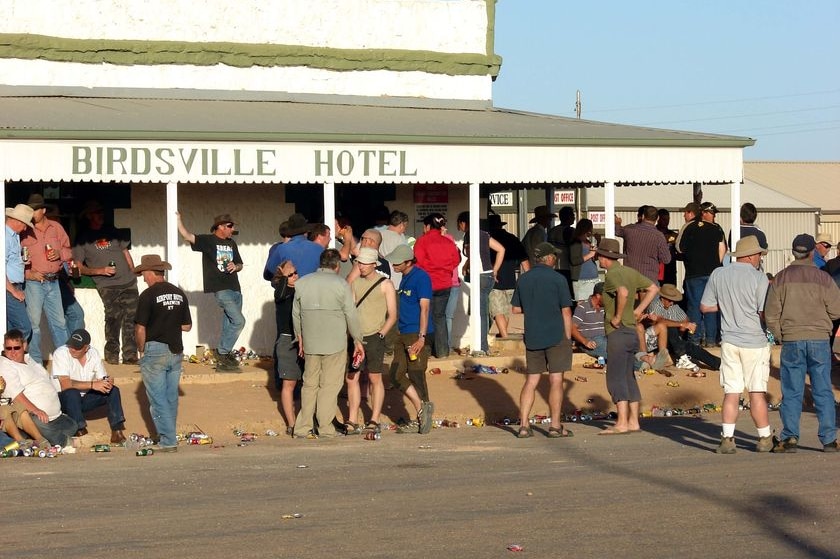 Patrons stand outside the Birdsville Hotel