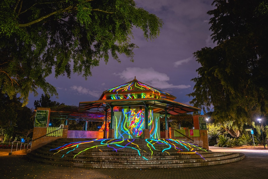 Coloured lights and textiles on the kiosk building for the Heartbeat artwork.