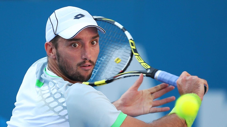 Viktor Troicki of Serbia plays a backhand in his semi final match against Gilles Muller of Luxembourg during day six of the 2015 Sydney International