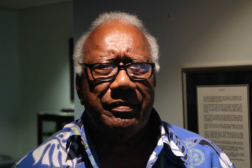 A South Sea Islander man wearing glasses