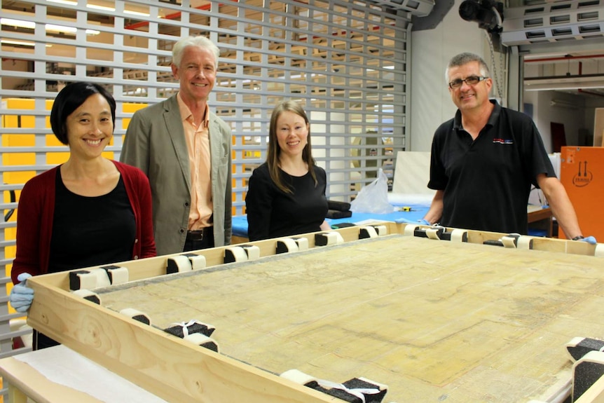 NLA staff members with the Blaue map