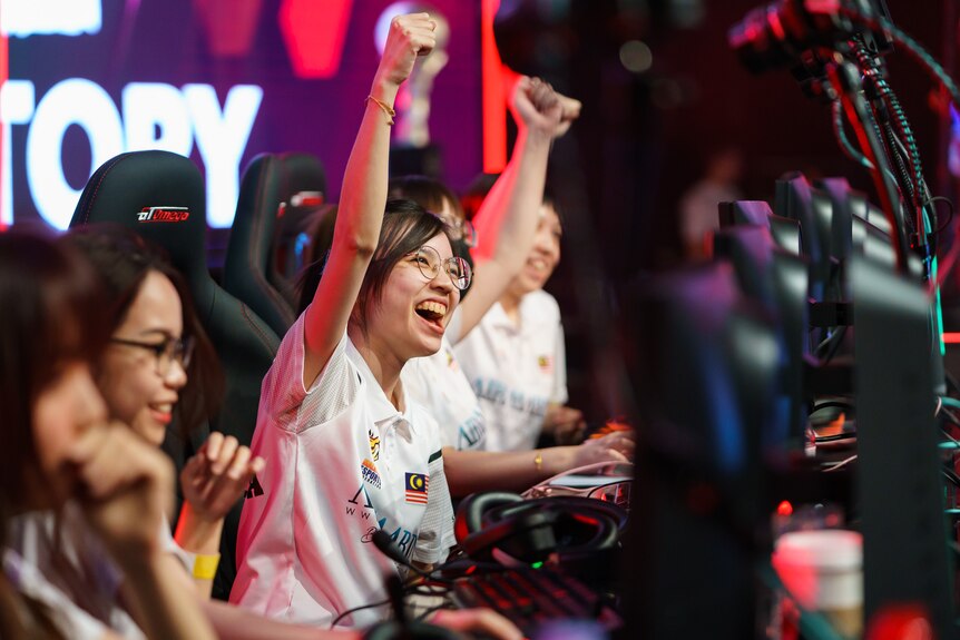 Women celebrate at the Commonwealth Esports Championships.