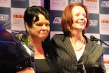 Gillard embraces former ACTU president at farewell dinner