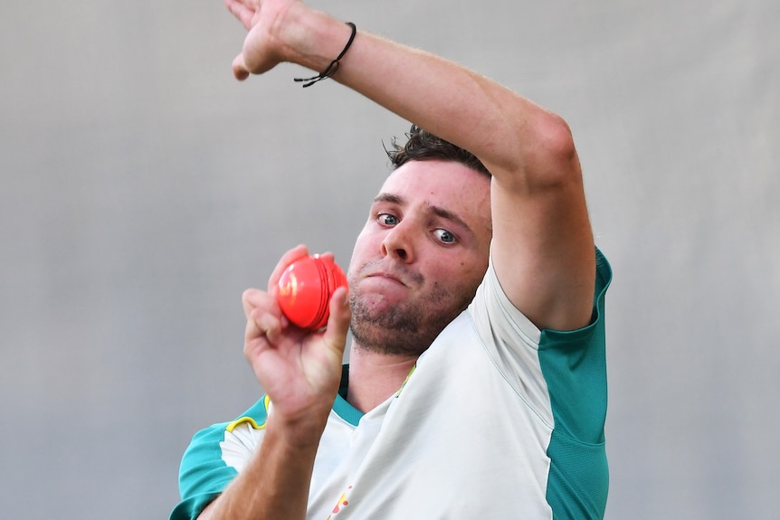 Jhye Richardson in the middle of his bowling action at training