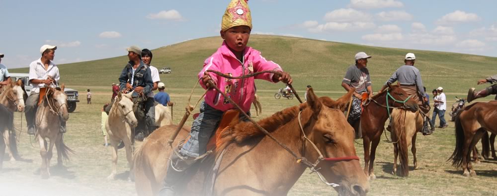 Child takes part in horse race in Mongolia