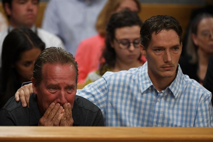 Frank Rzucek covers mouth to stifle cries as he looks to front bench during his son-in-law's sentencing for daughter's murder