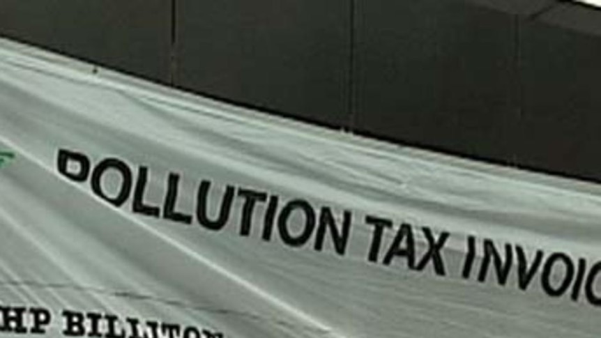 The so-called "pollution tax invoice" for $338 million, was hung from the building early this mornin