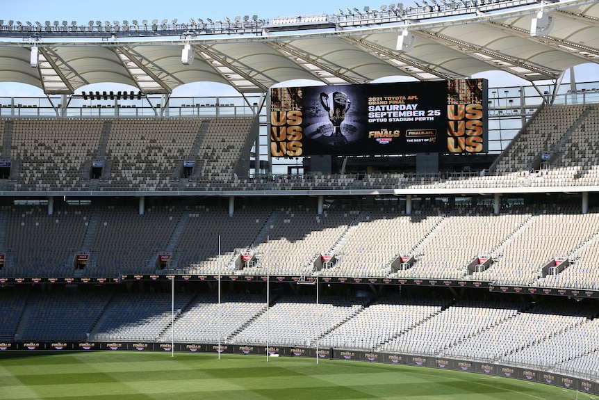 Interior of Perth Stadium showing the pitch, footy goals, stands and the big screen advertising the 2021 Grand Final