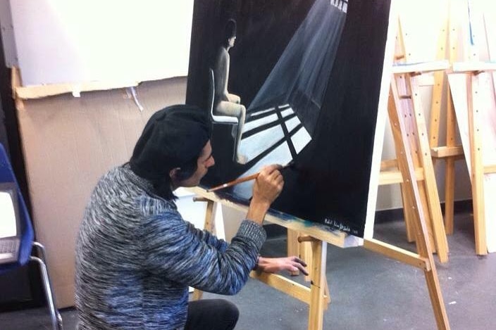 Babak Jahangirzadeh works on a paintings