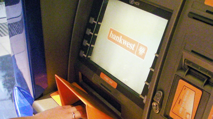 A person using a Bankwest ATM