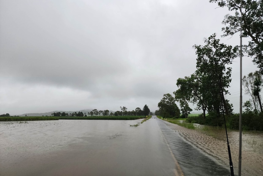 Water flows over a bitumen road